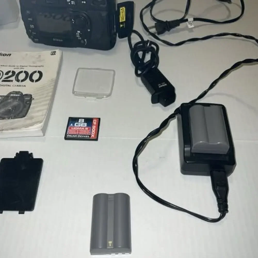 Nikon DS200 24 Mm Lens Plus Trigger 2 Batteries And Accessories